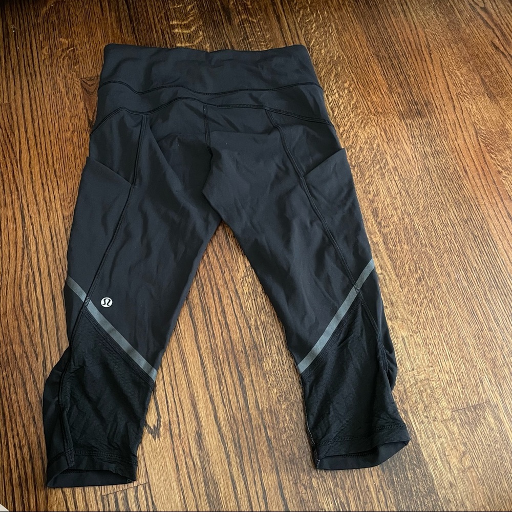 lululemon athletica Black Capri Leggings with Reflective Accent and Side Pockets